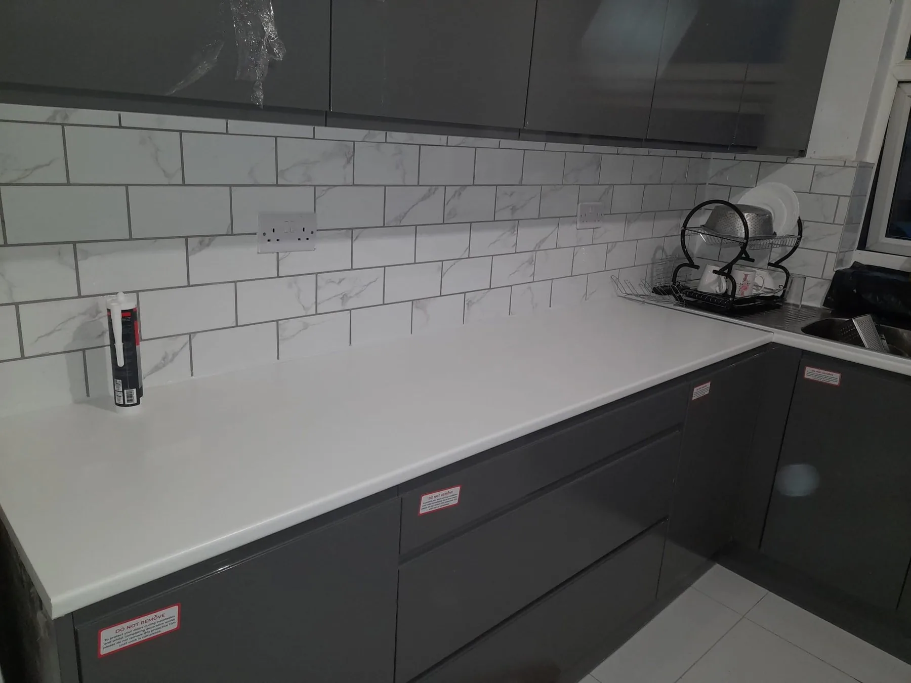 Completed kitchen worktop and tiled splashback by Campbell and Sons